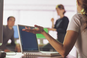 Team reviewing financial reports during end-of-month meeting